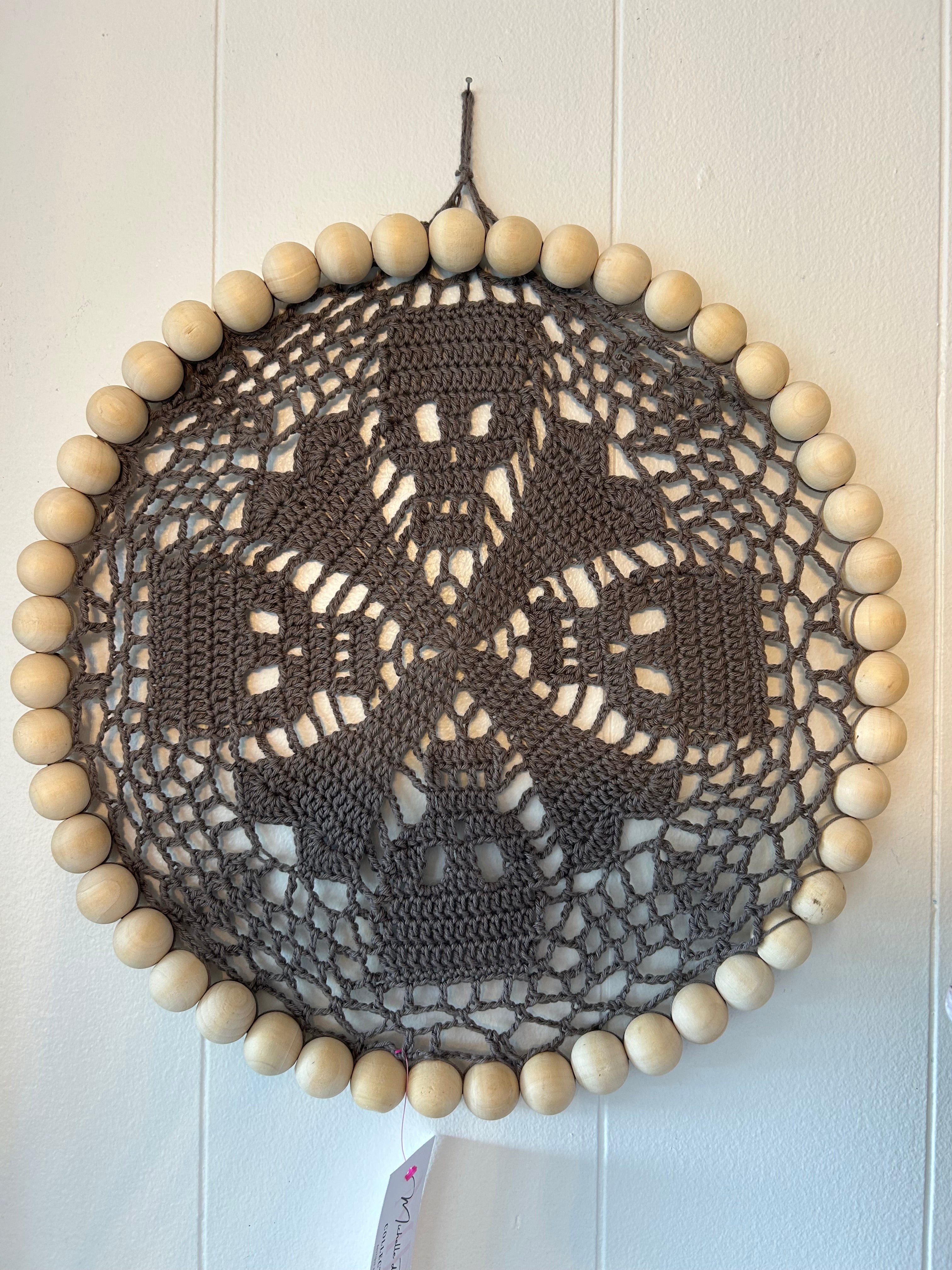 Handmade crocheted grey skull wall decor