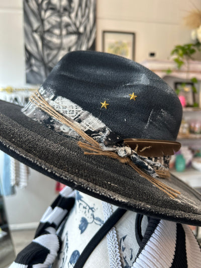 Wide brim black fedora hat with gold stars