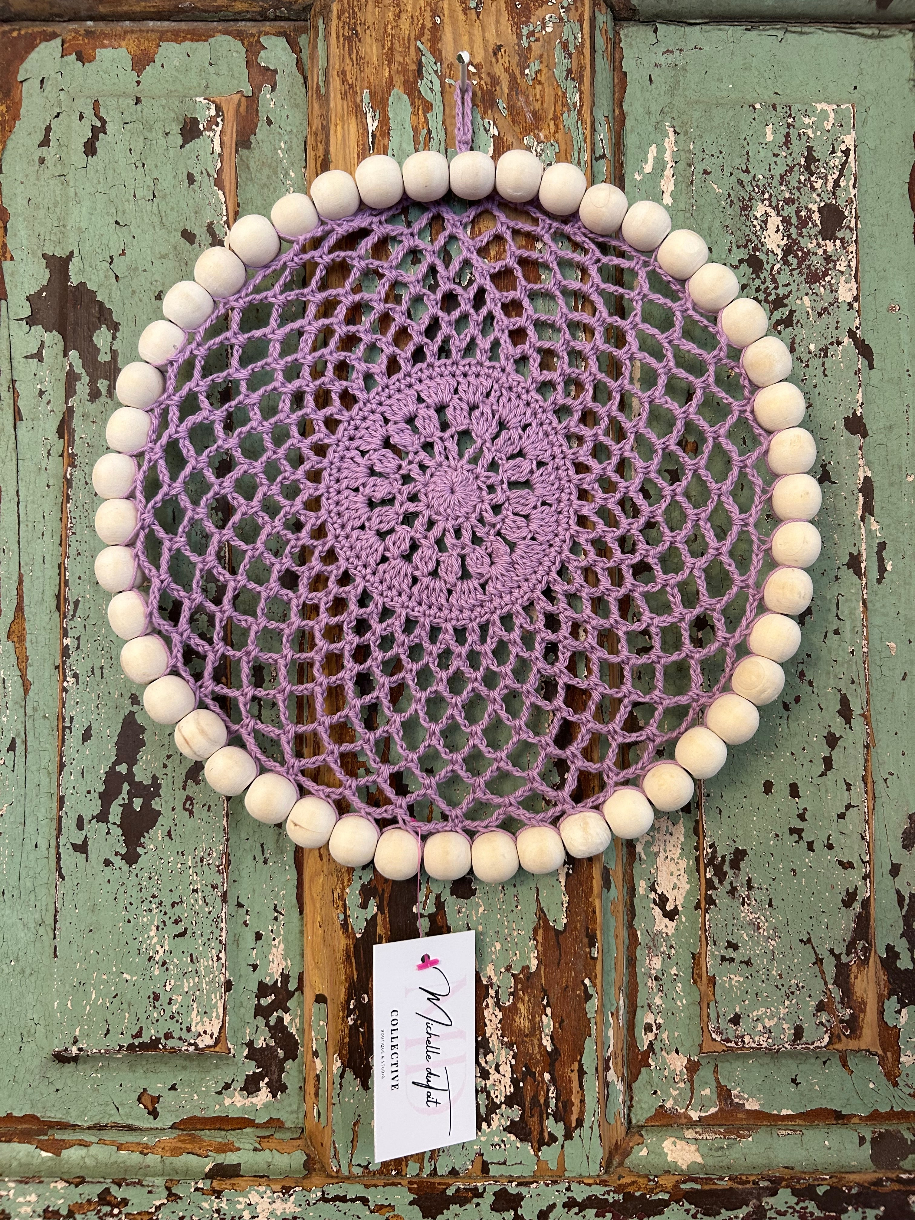 Handmade crocheted purple wall decor