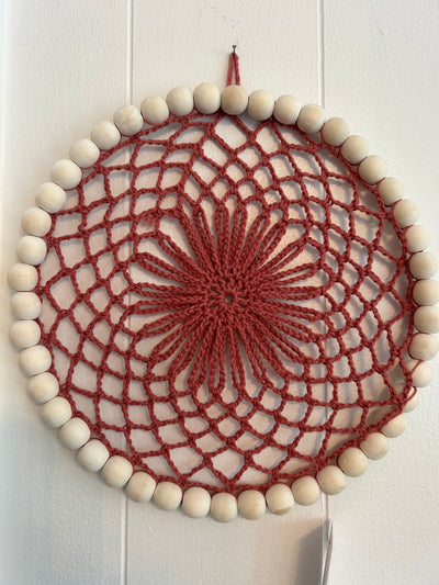 Handmade crocheted burnt orange wall decor